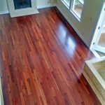 Red tinted wood flooring installation